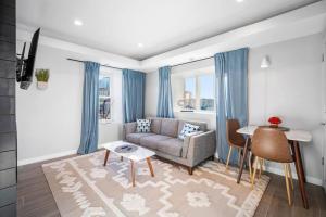 a living room with a couch and a table at Unit 3 European style King size bed Stockton College in Atlantic City