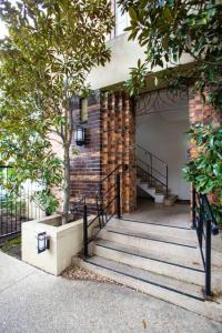 a set of stairs leading up to a building at Joli Light Filled Delight Close to the MCG in Melbourne