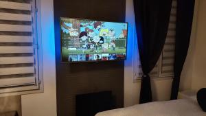 Telewizja i/lub zestaw kina domowego w obiekcie Appt 4P, parking, Disney direct, Vallée Village