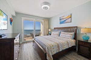 a bedroom with a bed and a view of the ocean at Laketown Wharf! Sleeps 9 - Resort Beach Condo, Stunning Ocean Views! by Dolce Vita Getaways PCB in Panama City Beach +47 photos