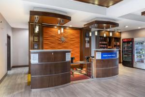 a store lobby with a wooden door and a counter at Best Western Plus Fort Stockton Hotel in Fort Stockton
