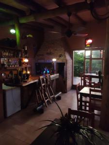 a restaurant with a table and chairs in a room at Parana Inn in Puerto Iguazú