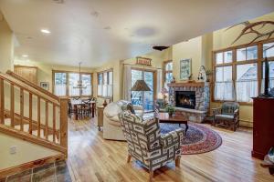 a living room with a couch and a fireplace at The Perfect Large Family Retreat condo in Beaver Creek