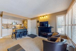 a living room with a couch and a table at Condo 505 at North Creek Resort in Blue Mountains