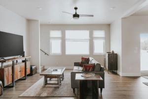 a living room with a couch and a tv at The Circle Unit B in Bozeman