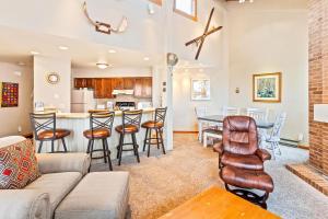 a living room with a couch and a table at Lodge at Steamboat A309 in Steamboat Springs