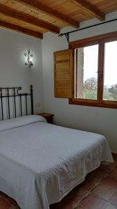 Postel nebo postele na pokoji v ubytování Casa Rural Ropino