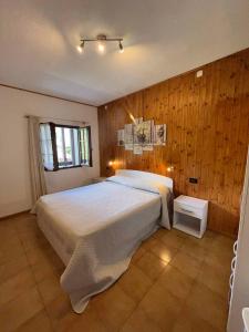 a bedroom with a large bed and a window at Apartment in Ledro - Ledrosee 43436 in Ledro