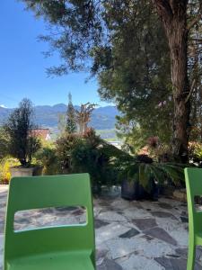 a green bench sitting on a patio with a view at Villa Paloma/ Home/ Office-Remote Office in Constanza