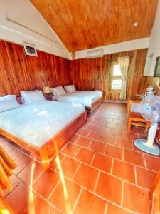 Postel nebo postele na pokoji v ubytování Viet Thanh Resort