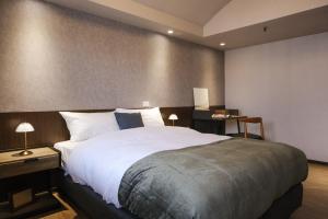 Postel nebo postele na pokoji v ubytování Giant Rich Hotel