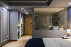 Postel nebo postele na pokoji v ubytování Giant Rich Hotel