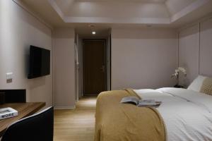 Postel nebo postele na pokoji v ubytování Giant Rich Hotel