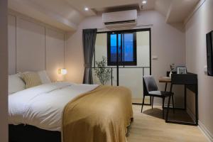 Postel nebo postele na pokoji v ubytování Giant Rich Hotel