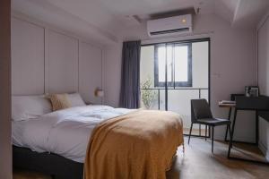 Postel nebo postele na pokoji v ubytování Giant Rich Hotel