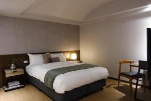 Postel nebo postele na pokoji v ubytování Giant Rich Hotel