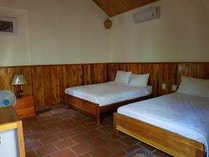 Postel nebo postele na pokoji v ubytování Viet Thanh Resort