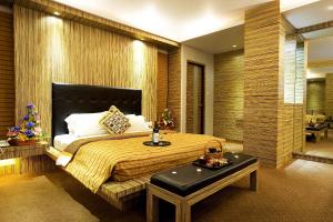 Ein Bett oder Betten in einem Zimmer der Unterkunft Hotel Maximillian