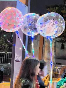 a woman standing in front of a bunch of bubbles at Josephine's 2Bdrm apt 50M to Bahai gardens in Haifa