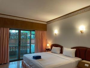 Postel nebo postele na pokoji v ubytování Phuket Golden Sand Inn - SHA Extra Plus + 27 fotografií