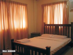 Ένα ή περισσότερα κρεβάτια σε δωμάτιο στο Crown Regency Suites Mactan