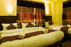 Łóżko lub łóżka w pokoju w obiekcie Hotel Adam