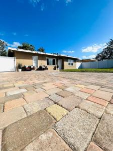 a brick patio in front of a house at 3 miles to Siesta Key #1 Beach in America in Sarasota