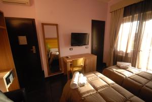 Кровать или кровати в номере Ostia Antica Suite B&B