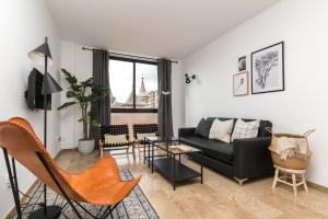 a living room with a couch and chairs at Picasso Suites 4.4 Paseo de Gracia in Barcelona