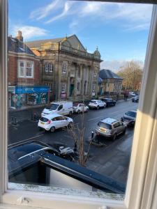 a view from a window of a street with parked cars at The Fort Lytham St Annes in Lytham St Annes