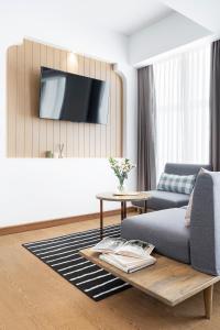 TV a/nebo společenská místnost v ubytování Darley Hotel Chiangmai