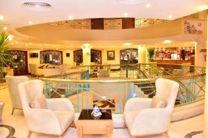 a lobby of a hotel with chairs and a table at Verginia Sharm Resort & Aqua Park in Sharm El Sheikh