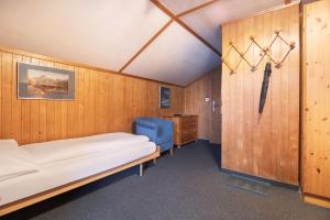 Letto o letti in una camera di Jungfrau Lodge, Swiss Mountain Hotel
