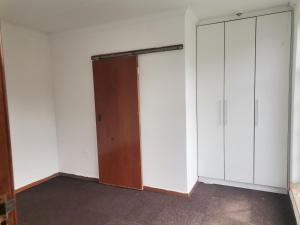 an empty room with two closets and a door at Luca's Place in Durban