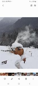 a picture of a snow covered field with a building at Maso Pin in Madonna di Campiglio