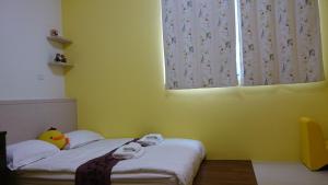 Rúm í herbergi á Amalfi Homestay