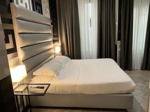 Postel nebo postele na pokoji v ubytování The One Firenze