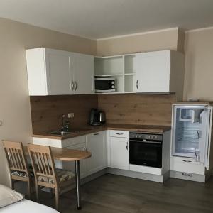 Kuchyň nebo kuchyňský kout v ubytování Apartment Hotel Rüther