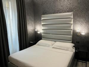Postel nebo postele na pokoji v ubytování The One Firenze