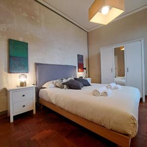 a bedroom with a large bed with two pillows on it at Apartment Corsica 11 in Florence