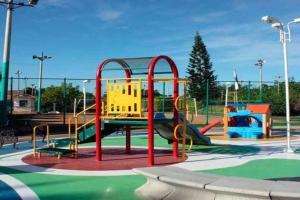 a playground with a slide in a park at Peñon Confortable Casa Para Descansar y Disfrutar in Girardot
