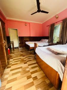 Katil atau katil-katil dalam bilik di Paradise Mount Resort
