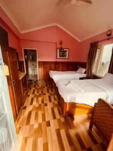 Katil atau katil-katil dalam bilik di Paradise Mount Resort