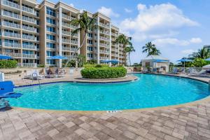 a swimming pool in front of a resort at Marco Beach Ocean Resort 607 in Marco Island