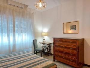 Ένα ή περισσότερα κρεβάτια σε δωμάτιο στο HAPPY LUCCA Casa Vacanze