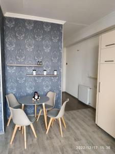 a dining room with a table and chairs at Apartment Sandra in Tbilisi City