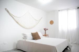 Katil atau katil-katil dalam bilik di Apartamento completo cerca a la playa parque de los novios en el centro historico