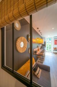 a living room with a view of a dining room at apartment air conditioning balcony private parking in Marseille