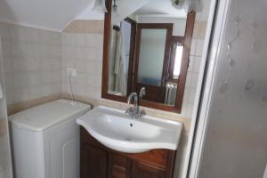 a bathroom with a sink and a mirror at La Ville CIR00002 in Allein +23 photos