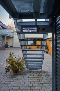 a set of stairs leading up to a building at Haus Rheinsheimer Scheuer in Philippsburg